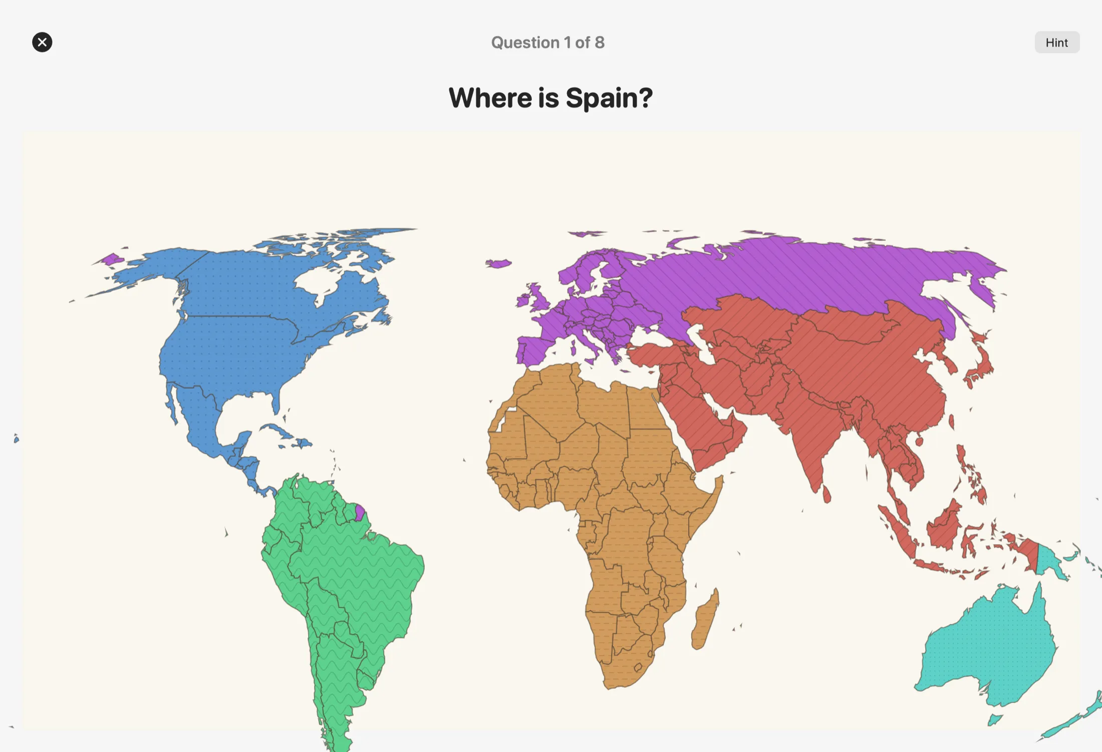 A Find the Country round in GeoKids asking ‘Where is Spain?’ over an equal-area world map.